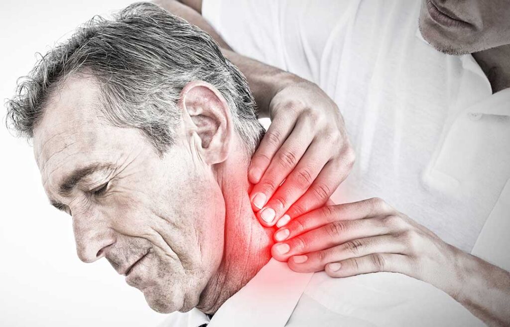 Person carefully rolling to the side and pushing up from bed while managing lower back pain.