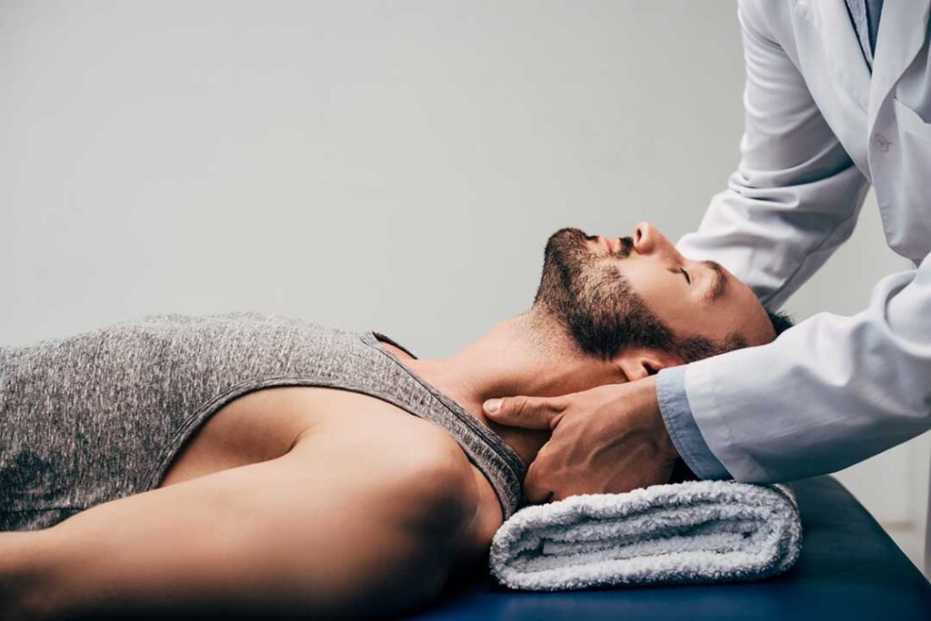 Person practicing gentle balance exercises beside a sturdy kitchen counter in a bright home.